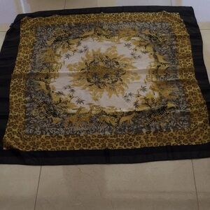 Scarf  INTO-AFRICA size 40” by 42” color Black, gold and white. NWOT #345